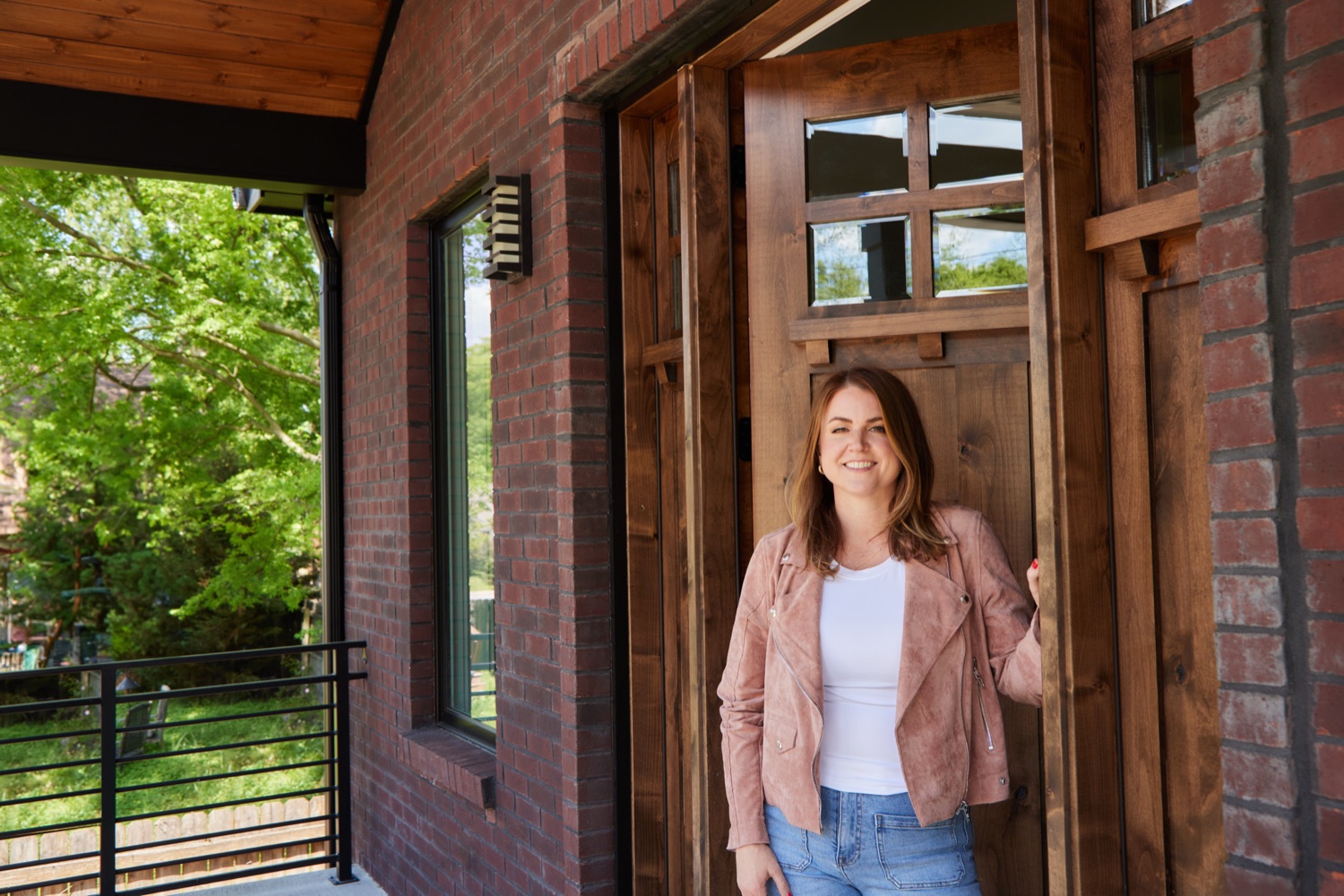 Erin Tunney at the entrance of a Nashville home