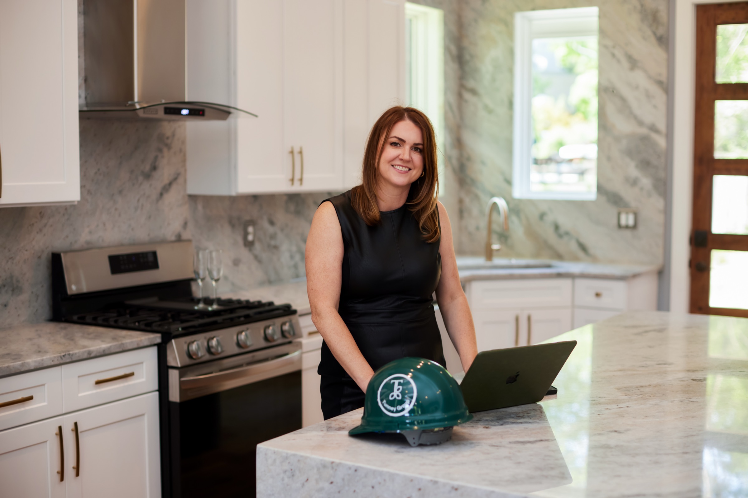 Erin Tunney working inside a completed Nashville kitchen