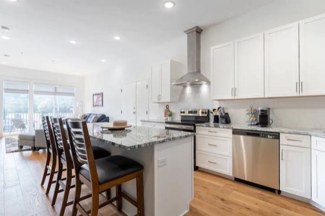 White kitchen with stone counters at The Avery
