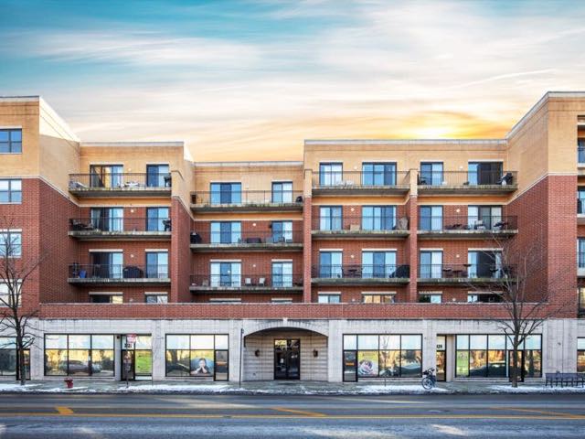 Brick courtyard and residential balconies at Logan View